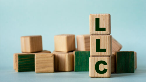 LLC acronym on wooden blocks